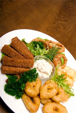 Appetizer made of fried onion, potato and bread Stockbilder - Microstock & Abonnement, Bildnummer: 400-05266258