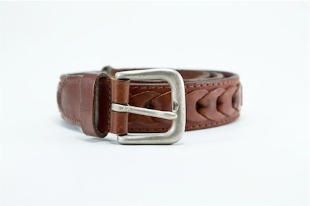 Brown leather belt. Isolated on white background with clipping path. Foto de stock - Super Valor sin royalties y Suscripción, Código: 400-05266343
