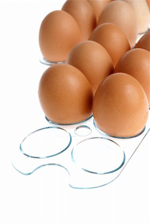 simsearch:400-04313912,k - Brown eggs on a acrylic transparent stand isolated on white background. Stockbilder - Microstock & Abonnement, Bildnummer: 400-05267179