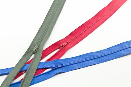 Colorful zippers on a white background Photographie de stock - Aubaine LD & Abonnement, Code: 400-05267426