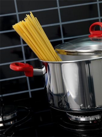 stainless steel stove top - Fettuccine pasta in a cooking pot ready for cooking Stock Photo - Budget Royalty-Free & Subscription, Code: 400-05267468
