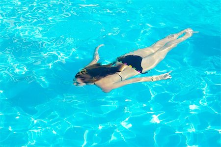 suit pool - Young woman swimming underwater in the swimming pool Stock Photo - Budget Royalty-Free & Subscription, Code: 400-05267660