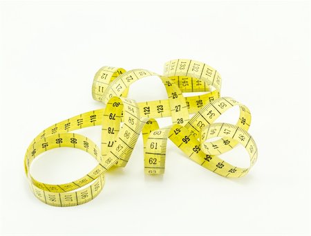 Yellow measuring tape isolated on white background Stock Photo - Budget Royalty-Free & Subscription, Code: 400-05267839