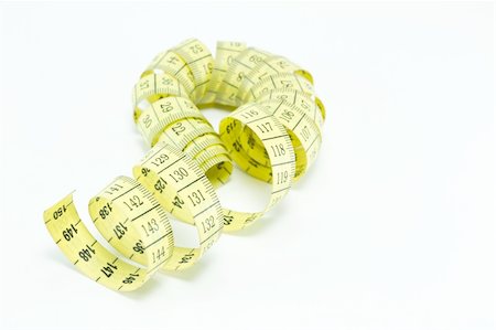 Yellow measuring tape isolated on white background Stock Photo - Budget Royalty-Free & Subscription, Code: 400-05267978
