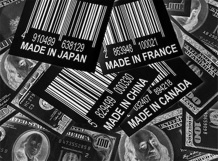 Spending american Money outside the US: one hundred dollar bills surrounding bar code with made in the Japan, Canada, France and China on it. All bar codes are fictional data. Photographie de stock - Aubaine LD & Abonnement, Code: 400-05268085