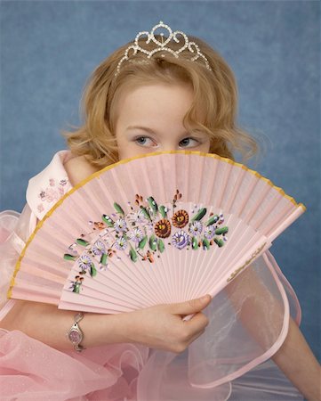 simsearch:400-04735006,k - Beautiful girl hides behind her fan on blue Stock Photo - Budget Royalty-Free & Subscription, Code: 400-05268107