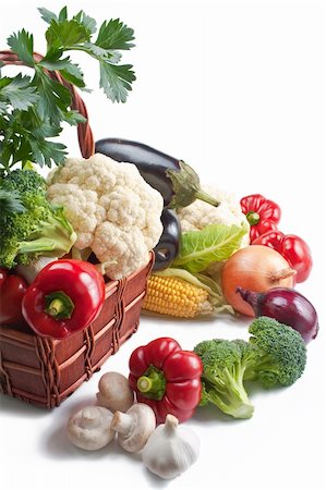 simsearch:400-04785187,k - Mix of fresh ripe vegetables placed in a wicker basket and around isolated on white background Photographie de stock - Aubaine LD & Abonnement, Code: 400-05268258