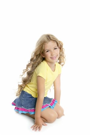 full photo in girls in studio - little blond girl smiling portrait on her knees isolated on white background Stock Photo - Budget Royalty-Free & Subscription, Code: 400-05268689