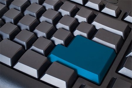 Blue empty enter button on black keyboard Stock Photo - Budget Royalty-Free & Subscription, Code: 400-05269565