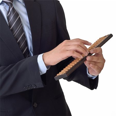 Business man use abacus of Chinese traditional financial tool. Stock Photo - Budget Royalty-Free & Subscription, Code: 400-05260425