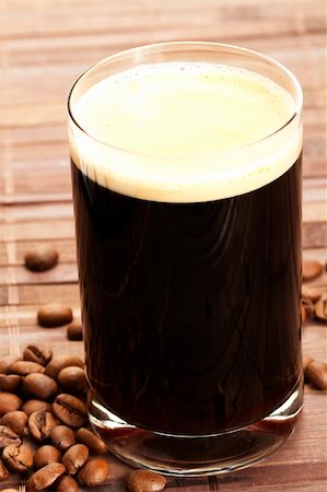 simsearch:400-05260472,k - espresso in a glass with coffee beans on wooden background Stock Photo - Budget Royalty-Free & Subscription, Code: 400-05260465