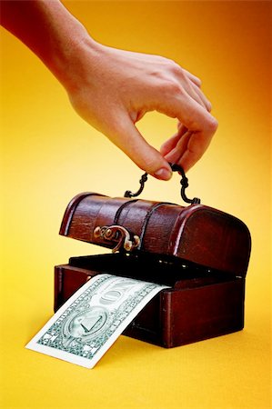 simsearch:614-05955597,k - Wood cashbox isolated on yellow Stock Photo - Budget Royalty-Free & Subscription, Code: 400-05261104