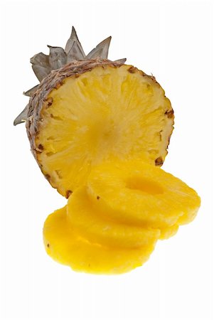 simsearch:400-07511100,k - Ripe pineapple with slices isolated on white background. Stockbilder - Microstock & Abonnement, Bildnummer: 400-05261521