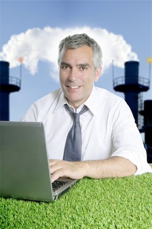 simsearch:400-04204942,k - senior businessman working green grass desk computer smog indutrial smoke pollution Stock Photo - Budget Royalty-Free & Subscription, Code: 400-05262175