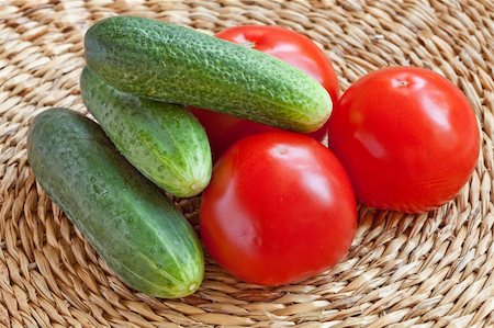 Still-life of Tomatoes and Cucumbers on a wicker background Stock Photo - Budget Royalty-Free & Subscription, Code: 400-05262218