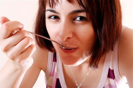 Young woman eating Foto de stock - Super Valor sin royalties y Suscripción, Código: 400-05262906