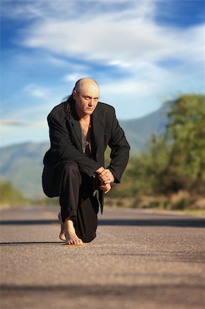 Strange indigenous man in the middle of a road Stock Photo - Budget Royalty-Free & Subscription, Code: 400-05263099