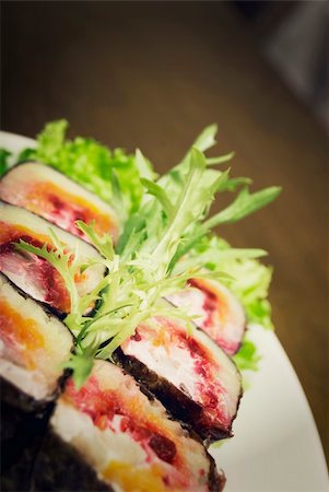 Portion of rolls served with salad on the oval plate Stockbilder - Microstock & Abonnement, Bildnummer: 400-05263142