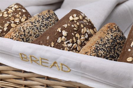 simsearch:400-04699541,k - Basket with different kinds of wholemeal bread. Focus on the embroidered word "bread" on the basket. Foto de stock - Super Valor sin royalties y Suscripción, Código: 400-05263606