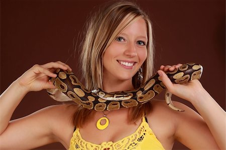 cute blond woman holding a Royal Python snake Stock Photo - Budget Royalty-Free & Subscription, Code: 400-05274046