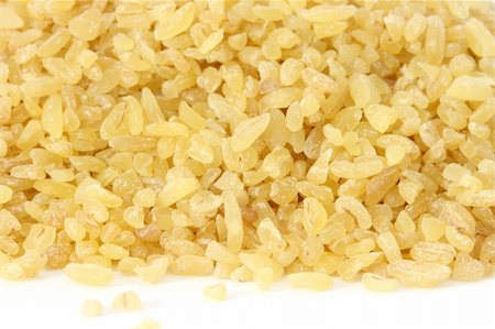 Bulgur - dired cracked wholegrain wheat - scattered on white background close up view Stock Photo - Budget Royalty-Free & Subscription, Code: 400-05274406