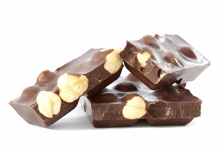 danicek (artist) - Dark chocolate with whole hazelnuts close up on white background Foto de stock - Super Valor sin royalties y Suscripción, Código: 400-05274403