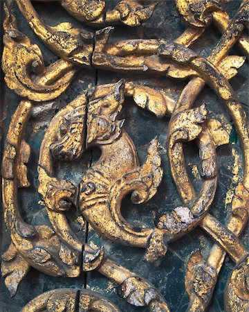 detail of Dragon carved left side on wooden door Stock Photo - Budget Royalty-Free & Subscription, Code: 400-05274973