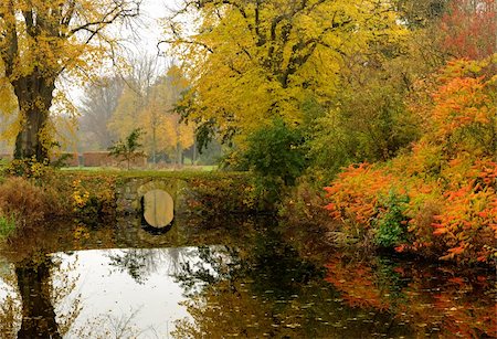 simsearch:862-06542108,k - Autumn in a park with an old bridge that crosses a small stream  a day with light haze Stock Photo - Budget Royalty-Free & Subscription, Code: 400-05275575