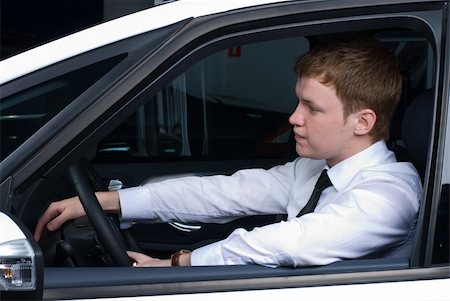 simsearch:400-07323023,k - Young man driving a car in a relaxed position Stock Photo - Budget Royalty-Free & Subscription, Code: 400-05275785