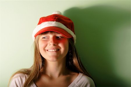 young girl with Santa's red cap.Look away Stock Photo - Budget Royalty-Free & Subscription, Code: 400-05276006