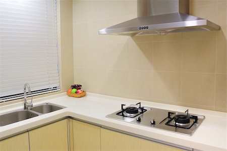 simsearch:400-08315056,k - Part of modern apartment kitchen with metal appliances. Fotografie stock - Microstock e Abbonamento, Codice: 400-05276157