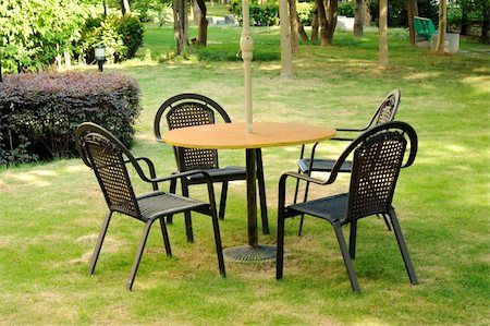 A warm patio with wooden bench and table in the afternoon sun. Stock Photo - Budget Royalty-Free & Subscription, Code: 400-05276153