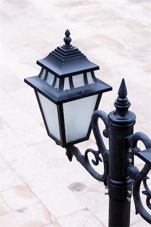 simsearch:400-07107921,k - Old style new black lamp post  on a stone floor in the street Foto de stock - Super Valor sin royalties y Suscripción, Código: 400-05276170