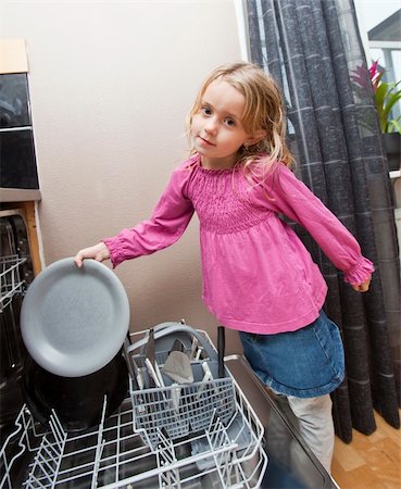 Young Girl by the Dishwasher with a plate Stock Photo - Budget Royalty-Free & Subscription, Code: 400-05276280