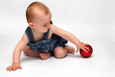 baby playing with the Christmas glass ball on the white background Stock Photo - Budget Royalty-Free & Subscription, Code: 400-05276706