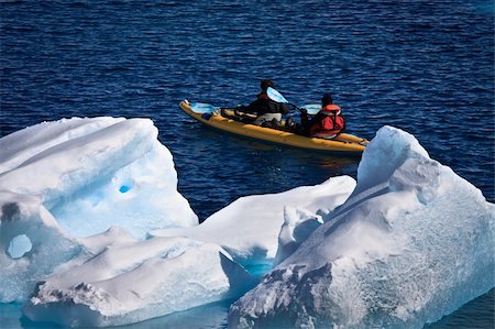 Two men in a canoe among icebergs in Antarctica Stock Photo - Budget Royalty-Free & Subscription, Code: 400-05277225