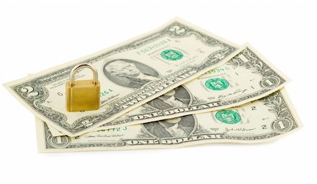 simsearch:400-04258349,k - padlock in stack of american dollars isolated on white Photographie de stock - Aubaine LD & Abonnement, Code: 400-05277409