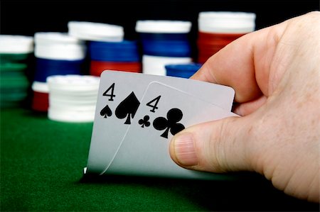 Pair of fours opening hand at Poker (From a series of opening hands at poker) Stockbilder - Microstock & Abonnement, Bildnummer: 400-05277479