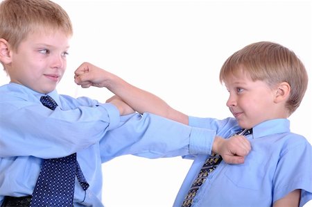 Two schoolboys fighting. Isolated over white. Stock Photo - Budget Royalty-Free & Subscription, Code: 400-05277709