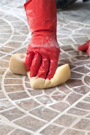 poured concrete construction - Close up of construction worker installing decorative tiles Stock Photo - Budget Royalty-Free & Subscription, Code: 400-05277903