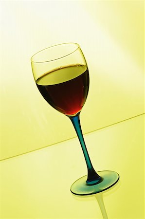 simsearch:400-07450722,k - Wineglass with red wine  on yellow background Stock Photo - Budget Royalty-Free & Subscription, Code: 400-05278034