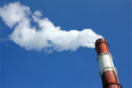 factory chimney with smoke under blue sky Stock Photo - Budget Royalty-Free & Subscription, Code: 400-05278370