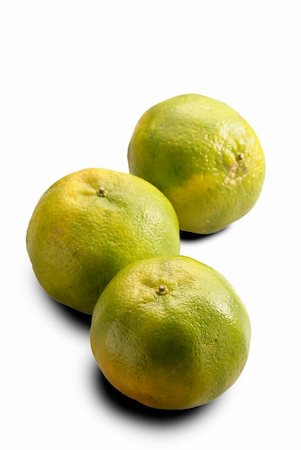 simsearch:400-05240866,k - Tangerines, group of green color fruit isolated on white. Fotografie stock - Microstock e Abbonamento, Codice: 400-05278404