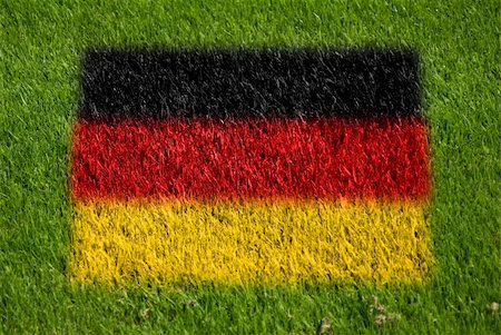 fairplay - flag of germany on grass with spray Stockbilder - Microstock & Abonnement, Bildnummer: 400-05278425