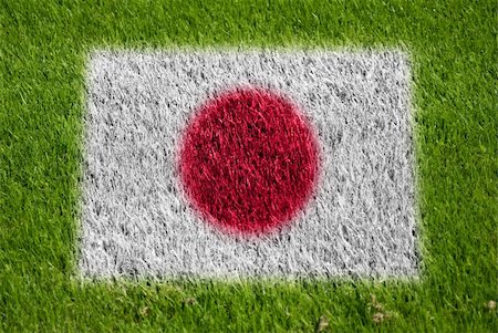 fairplay - flag of japan on grass with spray Stockbilder - Microstock & Abonnement, Bildnummer: 400-05278430