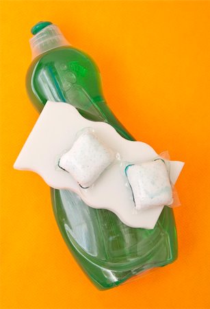 Liquid and Powdered Dishwashing Liquid with a White Sponge on a Vibrant Orange Background. Stock Photo - Budget Royalty-Free & Subscription, Code: 400-05278845