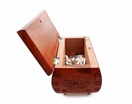 An open casket for jewelry made of wood with pearl and gold Stock Photo - Budget Royalty-Free & Subscription, Code: 400-05279281