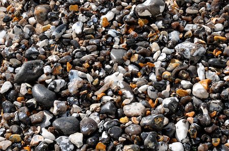 Wet shingle and pebbles seen from above Stockbilder - Microstock & Abonnement, Bildnummer: 400-05279373