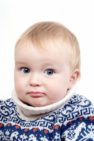 simsearch:400-04093413,k - portrait of confused baby in switter on a white isolated background Stock Photo - Budget Royalty-Free & Subscription, Code: 400-05279440