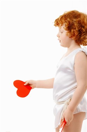 Profile of the small cupid with heart in a hand, isolated on a white background Photographie de stock - Aubaine LD & Abonnement, Code: 400-05279766